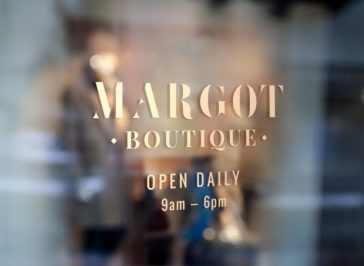 shop name gold sticker sticked on glass