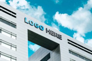 Free Building Embossed Logo Signage Mockup PSD
