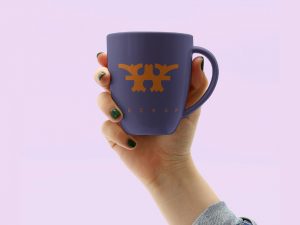 Free Hand Holding Mug Mockup PSD