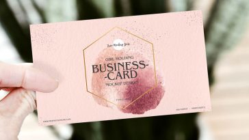 Women Holding Business Card Mockup PSD