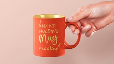 Free Hand Holding Mug PSD Mockup
