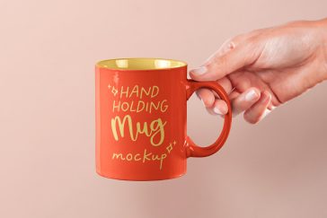 Free Hand Holding Mug PSD Mockup
