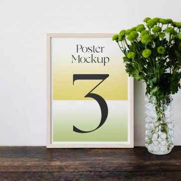 Free Poster Frame Against Wall Mockup