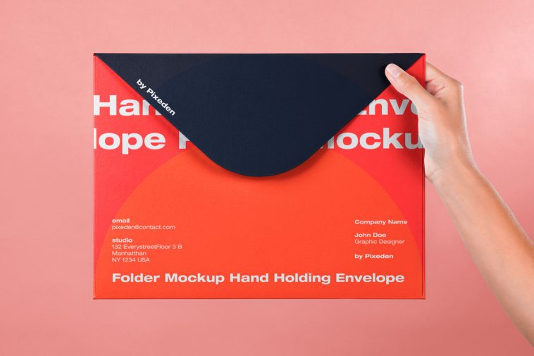 Free Hand Holding Large Envelope Mockup PSD