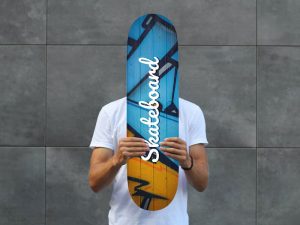 Man Holding Skateboard PSD Mockup
