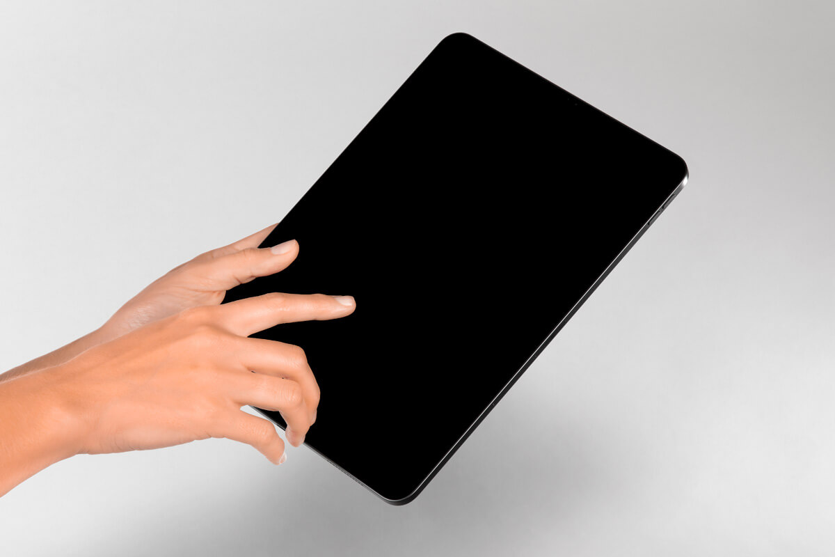 Hand Holding iPad Mockup PSD