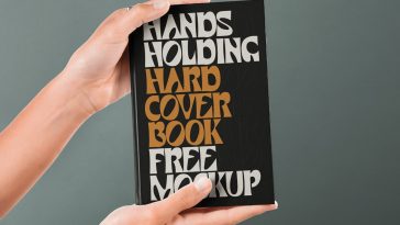 Hand Holding Hardcover Book Mockup