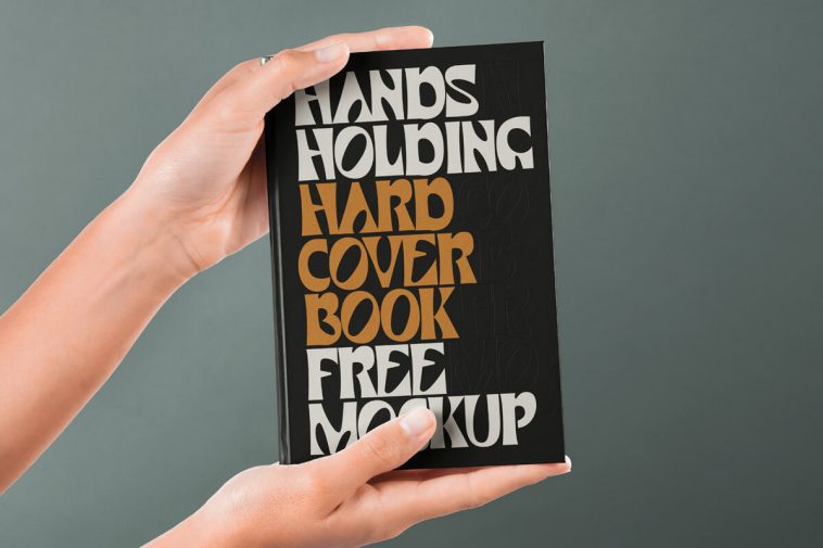 Hand Holding Hardcover Book Mockup