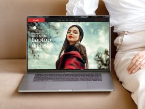 Free Woman Sitting Beside Laptop Website Mockup