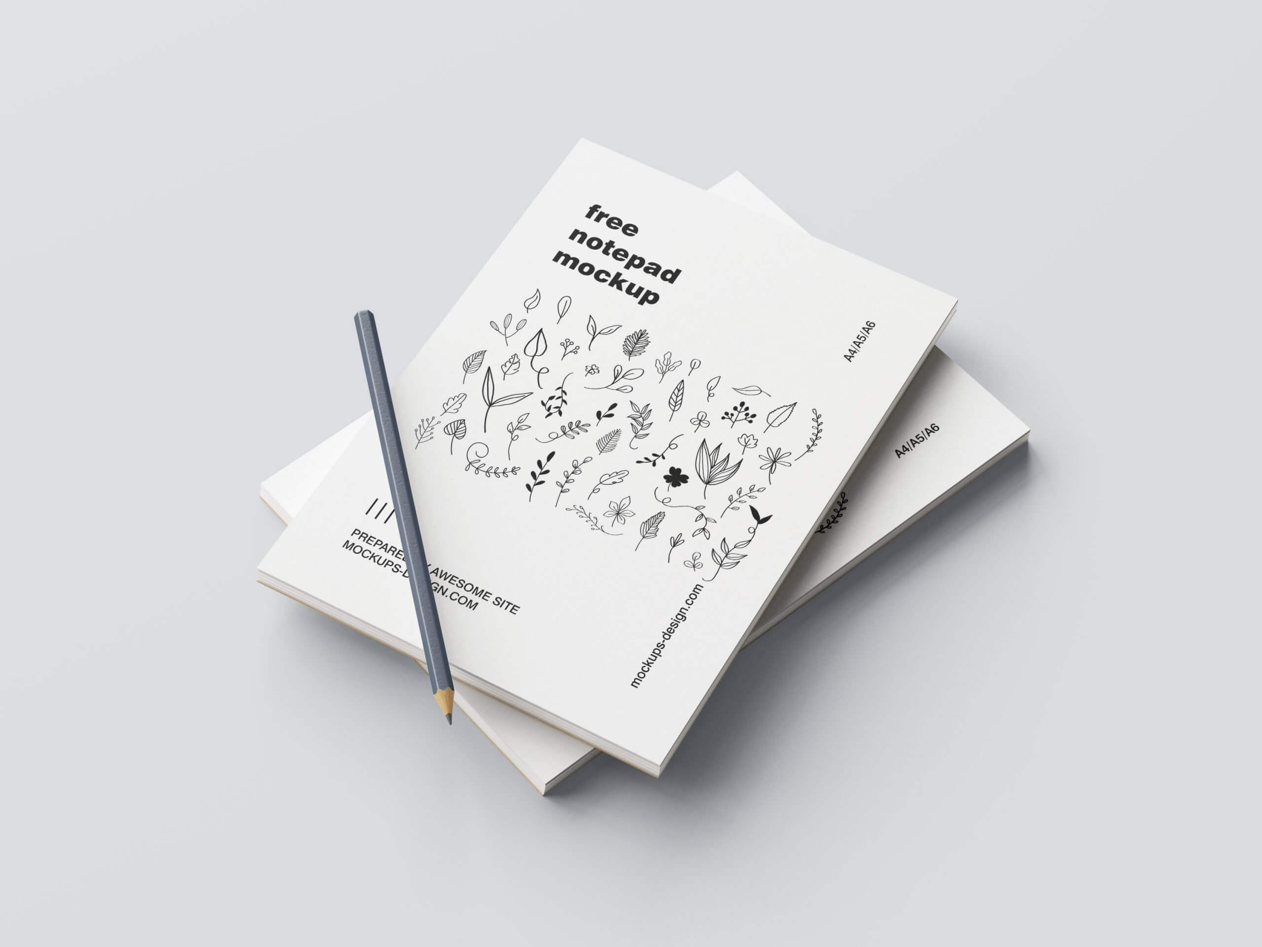5 Mockups of Notepad with Pencil in Various Perspective Views