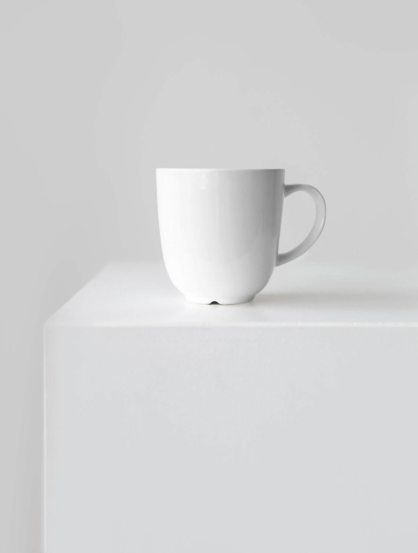 Front View of a Ceramic Mug Mockup on a Cube 
