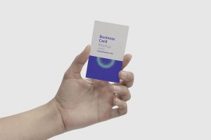 Mockup Showcasing a Hand Holding a Business Card