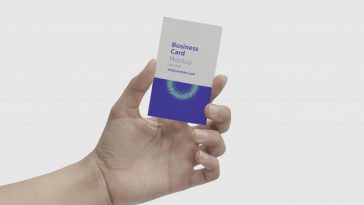 Mockup Showcasing a Hand Holding a Business Card