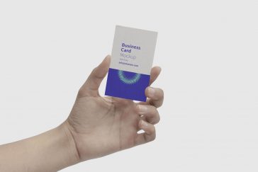 Mockup Showcasing a Hand Holding a Business Card