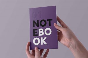 Free Hands Holding Notebook Mockup PSD