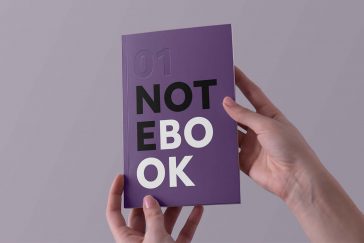 Free Hands Holding Notebook Mockup PSD