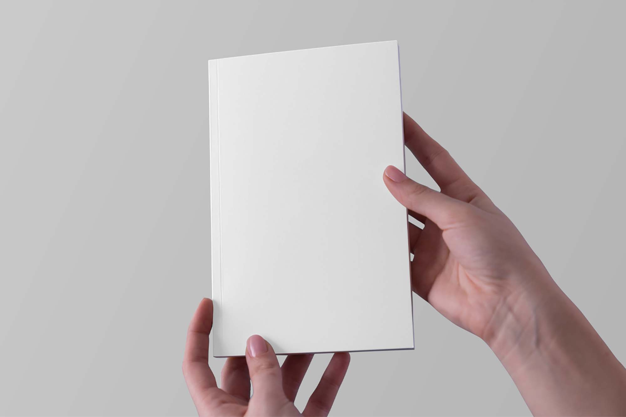 Free Hands Holding Notebook Mockup PSD