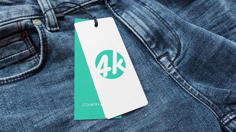 Overhead View of Two Label Tags Attached to Jeans Mockup