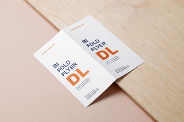 Bifold Dl Flyer Lying on a Wooden Board Mockup