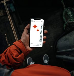 Free Travel Hand Holding Phone Mockup PSD