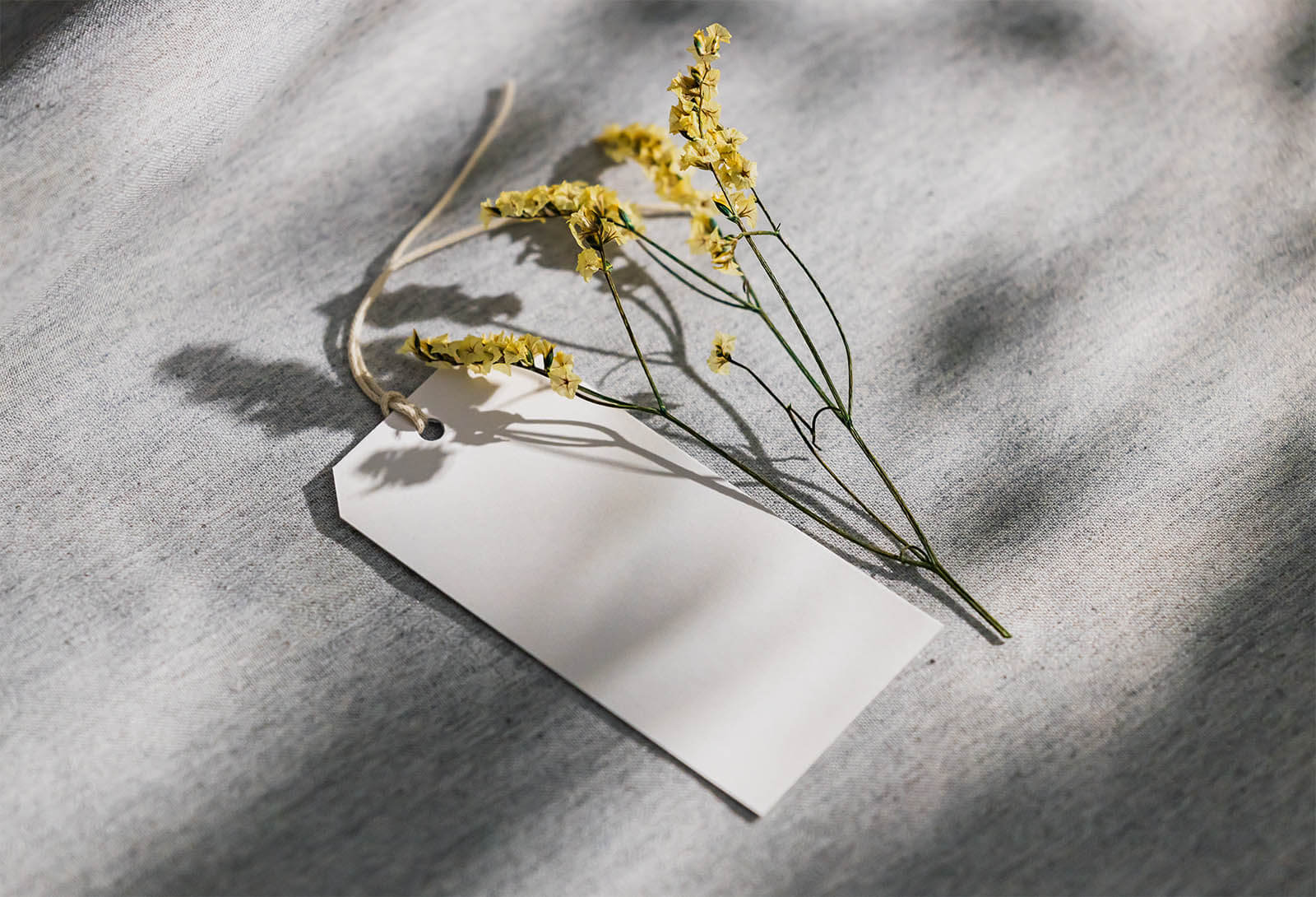 Free Yellow Flower Hanging Tag Mockup PSD