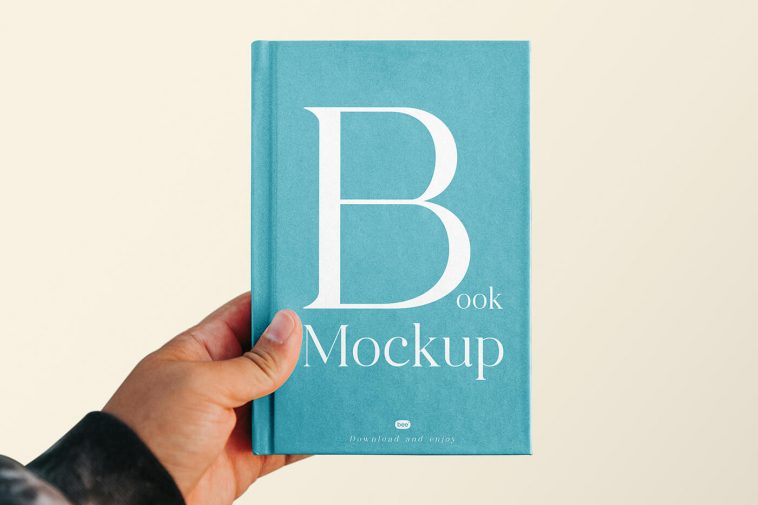 Free Book Cover with Hand Mockup