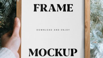 Free Wooden Frame in Hand Mockup
