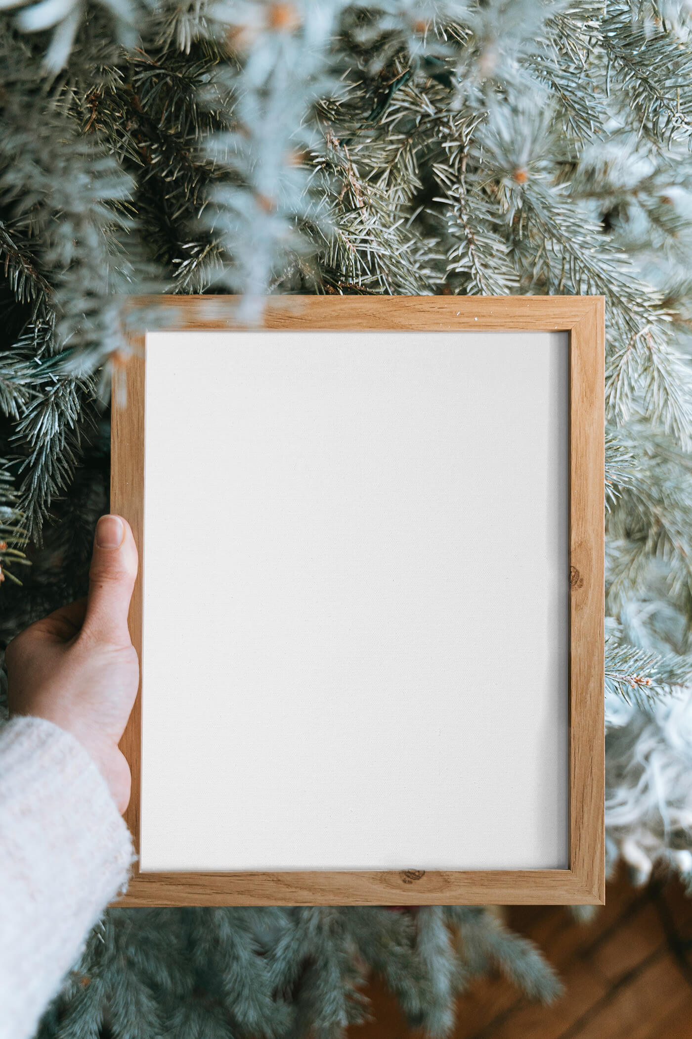 Free Wooden Frame in Hand Mockup