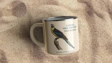 Free Enamel Mug on Sand Mockup