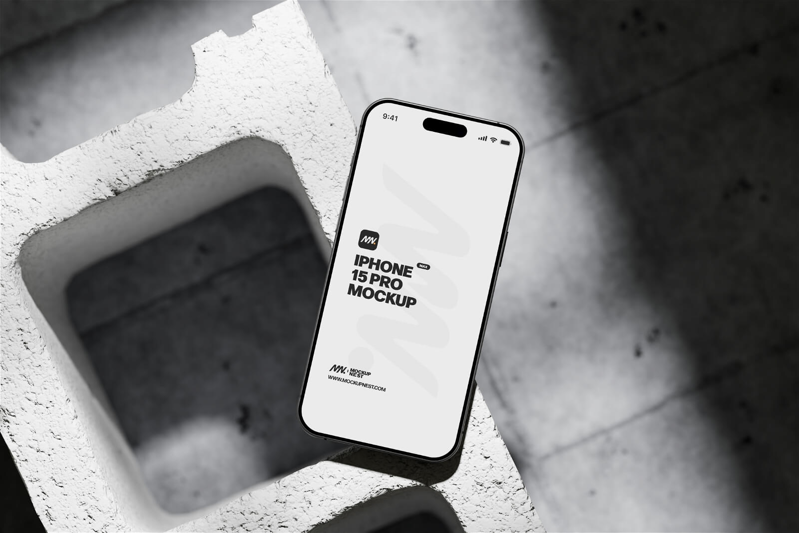 Free iPhone 15 Pro On Concrete Brick Mockup PSD Set