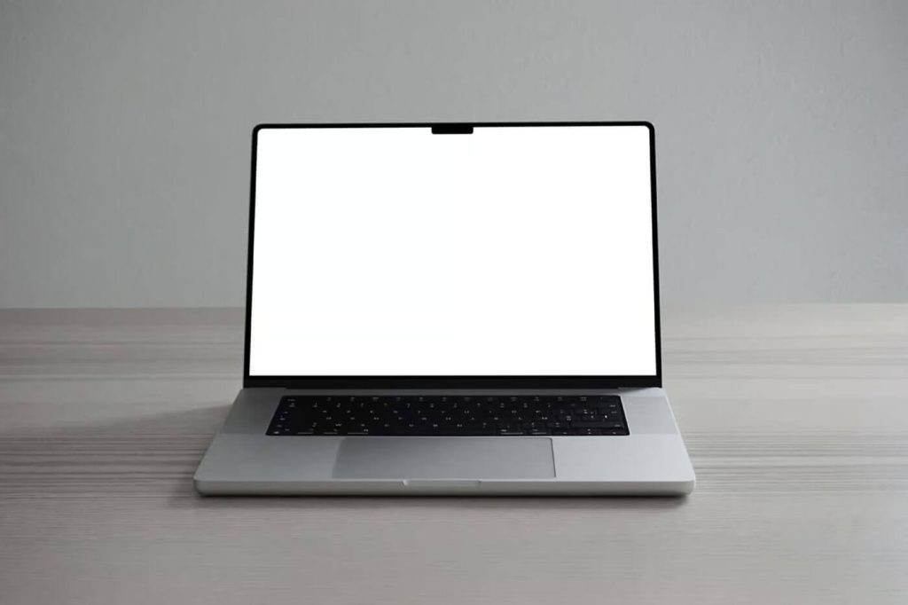 Free Silver MacBook Pro on Desk Mockup