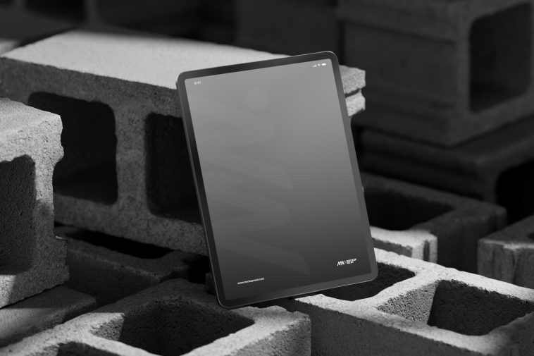 Free Vertical iPad Pro On Concrete Brick Mockup PSD