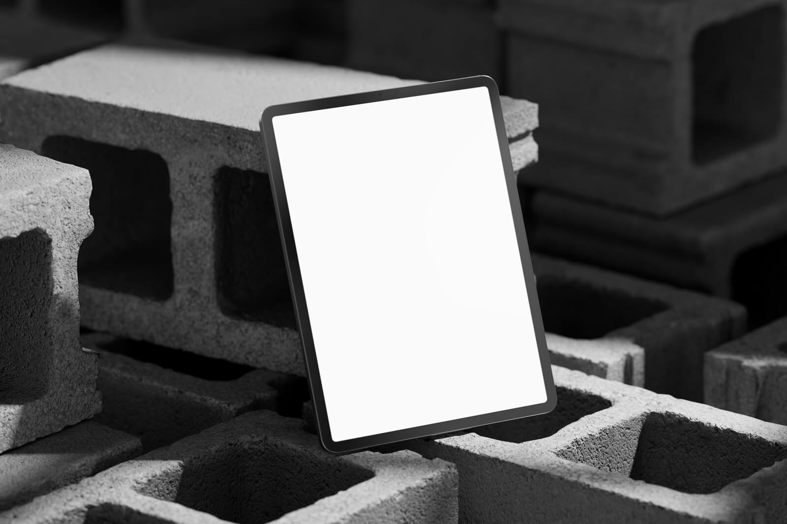 Free Vertical iPad Pro On Concrete Brick Mockup PSD