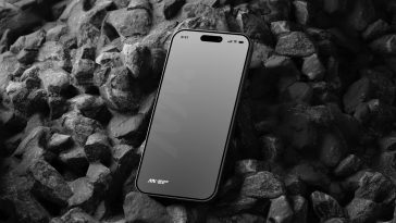 Free iPhone 15 Pro On Black Stone Mockup PSD