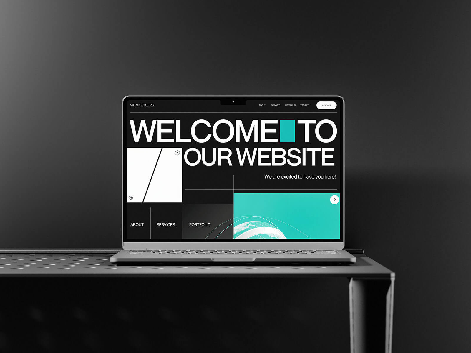 Free MacBook On A Black Table Mockup PSD Set