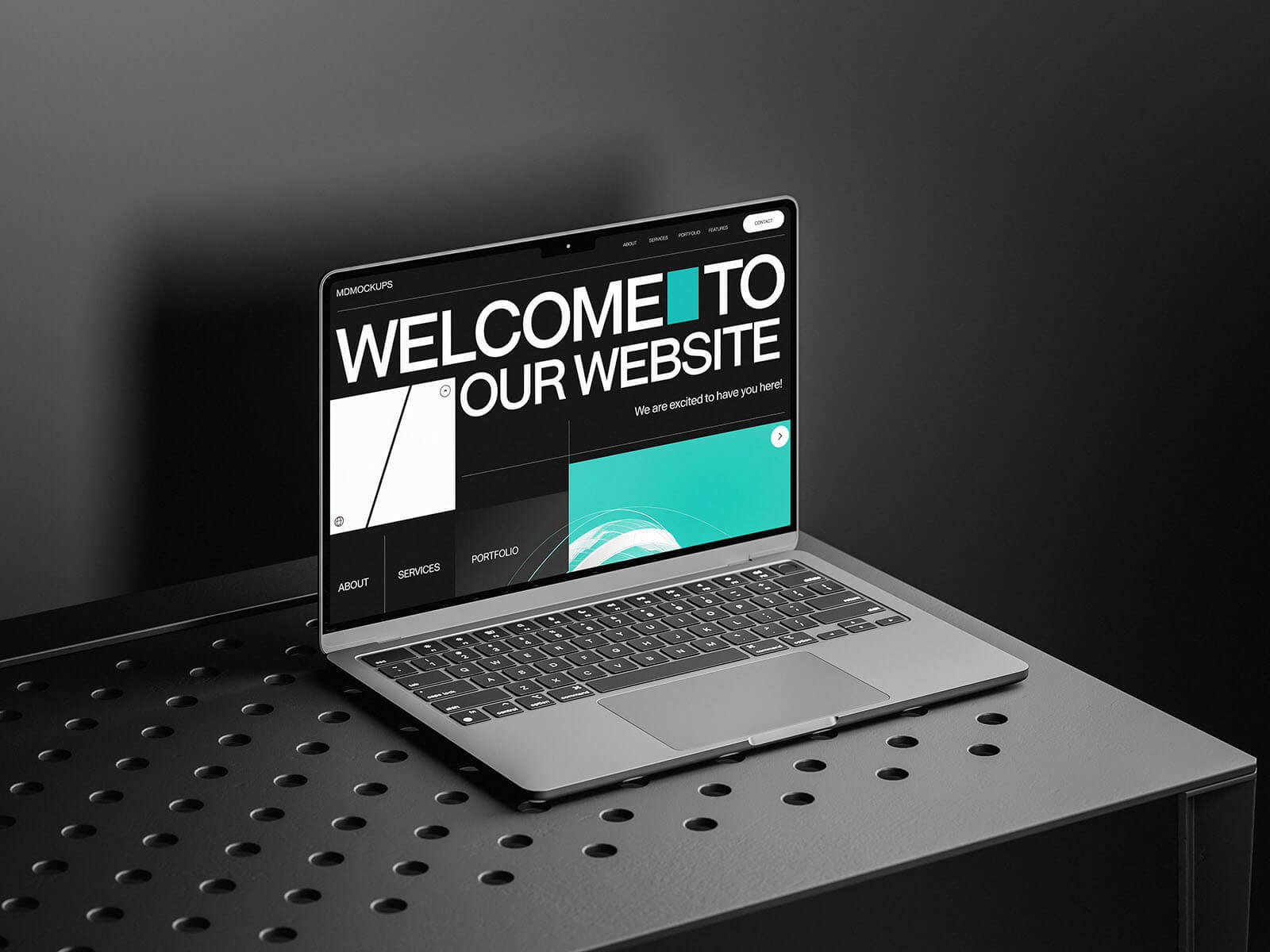 Free MacBook On A Black Table Mockup PSD Set