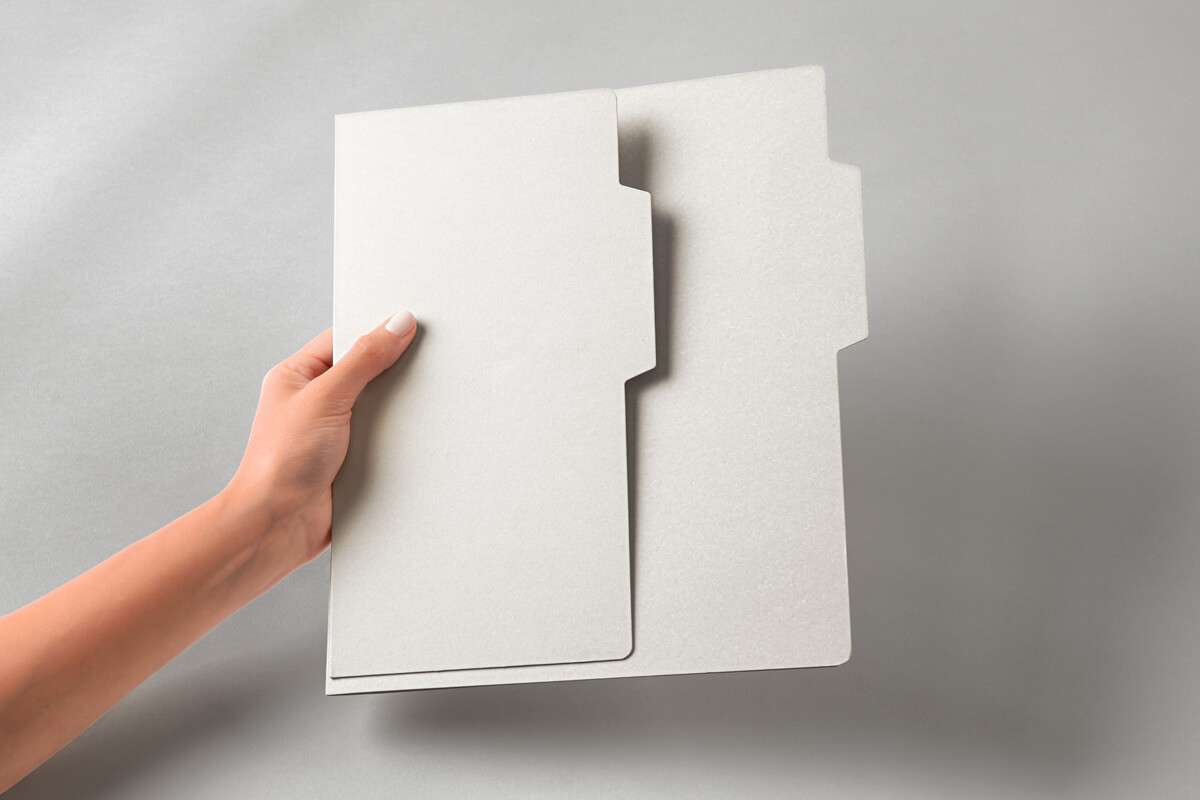 Free Hand Holding Folder Mockup PSD