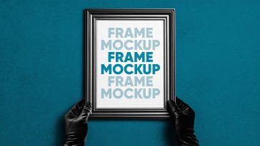 Free Hand Holding Photo Frame Mockup PSD