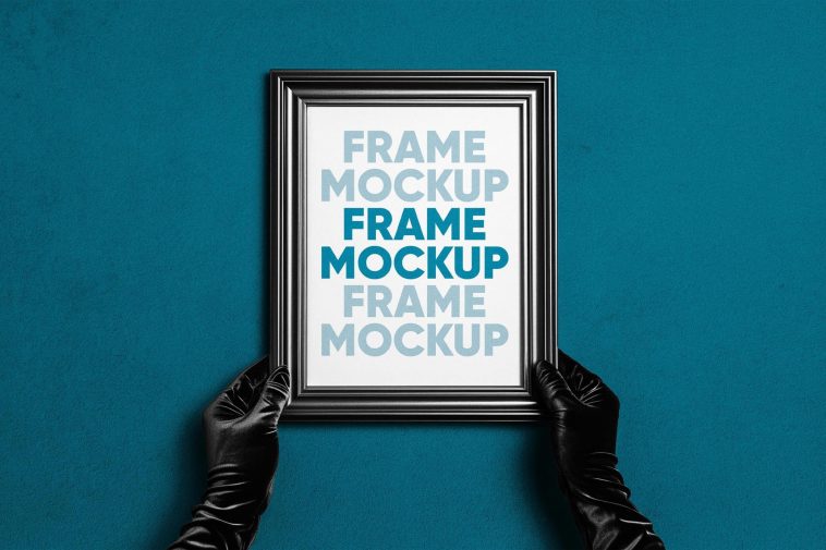 Free Hand Holding Photo Frame Mockup PSD