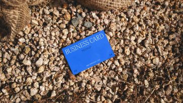 Free Business Card Laying on Stones Mockup