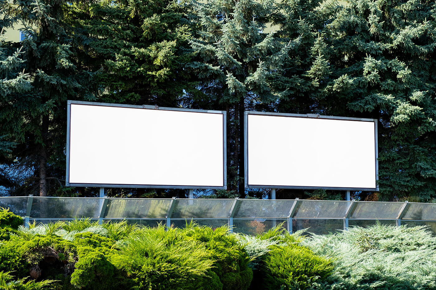 Free Outdoor Billboard Greenary Surrounding Mockups PSD Files