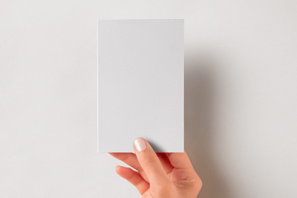 Free Hand Holding Vertical Greeting / Invite Card Mockup PSD