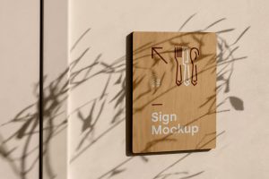 Free Wall-Mounted Wooden Sign Mockup PSD