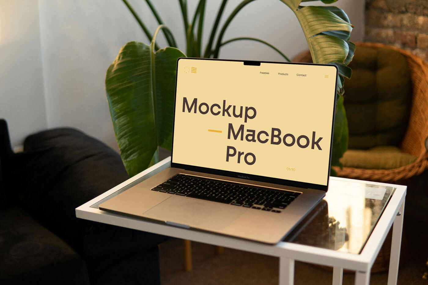 Free MacBook Pro On Small Table Mockup PSD