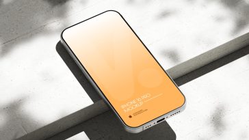 Free Silver iPhone 16 Pro On Concrete Mockup PSD