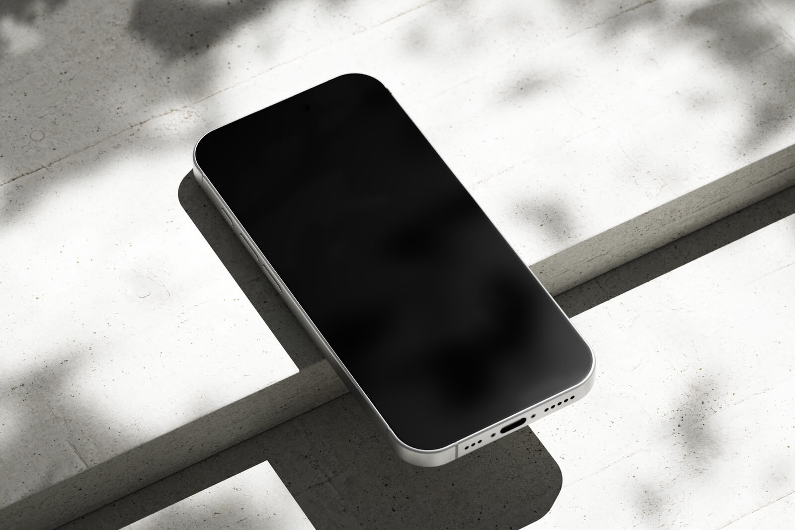 Free Silver iPhone 16 Pro On Concrete Mockup PSD
