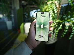 Free Hand-Holding iPhone 17 Mockup PSD