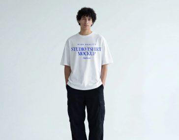 urban streetwear studio t shirt mockup with model minimal background high quality apparel mockup PSD