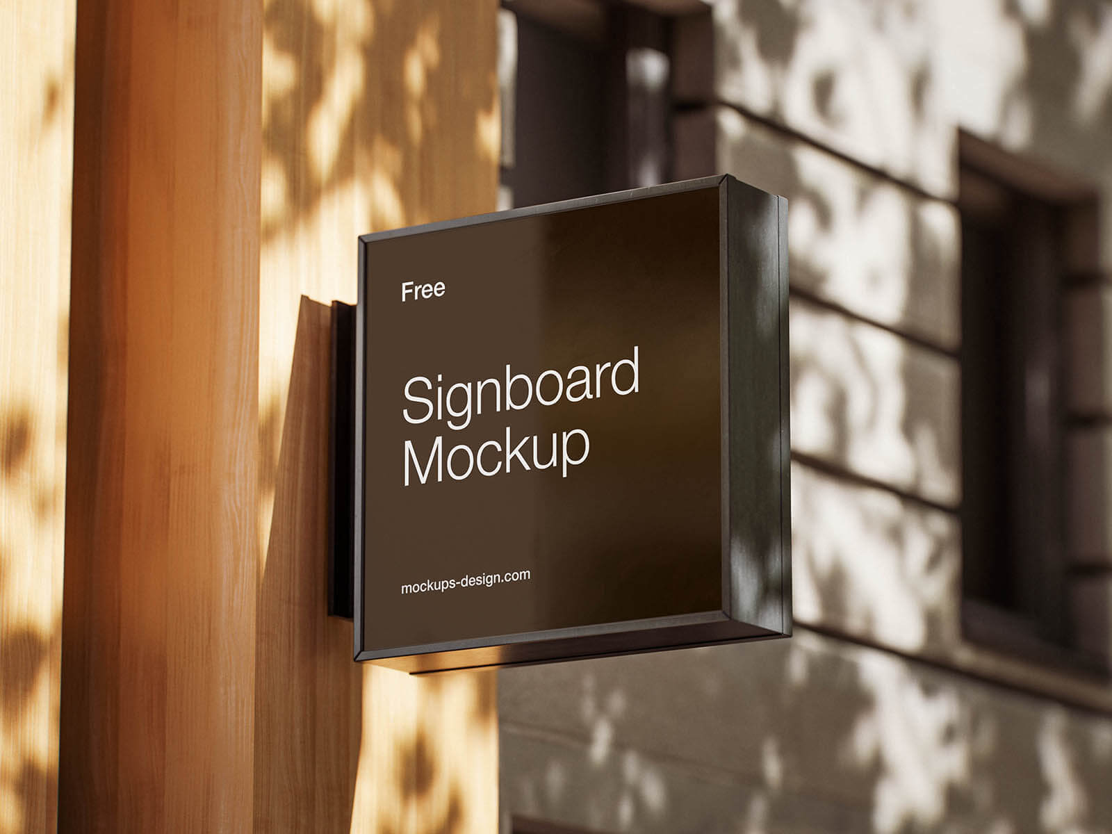 Black storefront signboard mockup PSD with realistic outdoor lighting and wall shadows